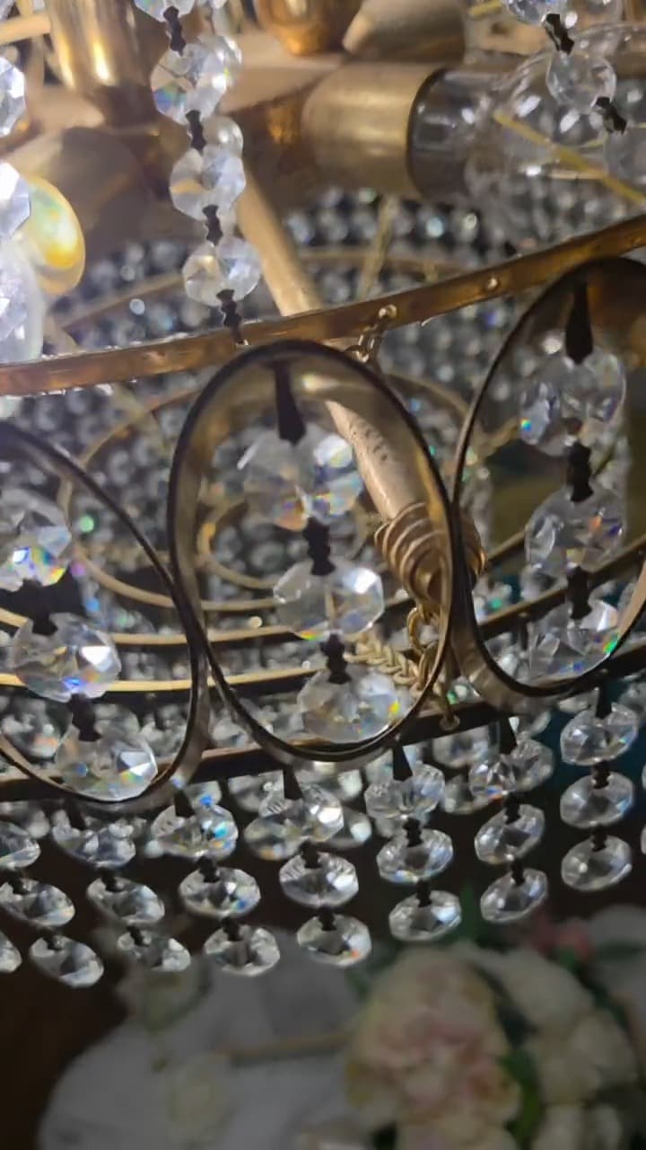 Cut crystal chandelier glowing above an event space